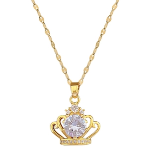 Luxurious gold crown necklace featuring a large round crystal pendant on a decorative chain