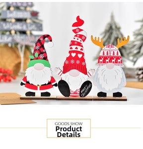 Close-up of three festive wooden Christmas gnomes with plaid patterns and Merry Christmas text