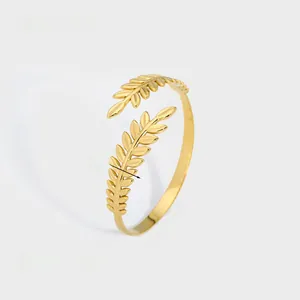 Detail shot of golden laurel leaf open bangle showing 1.2cm width and 11.7g weight