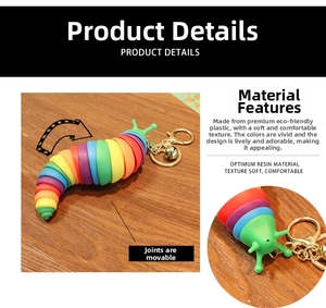 Close-up of flexible rainbow slug keychain with sliding joints and gold bell accessory