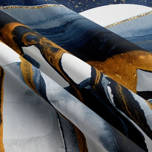 Macro shot of abstract mountain tapestry with golden veins and deep blue marble texture