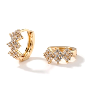 Exquisite gold huggie earrings featuring geometric pavé zircon stones on a white background