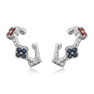 Detailed view of silver clover ear bone clip set with red and blue cubic zirconia stones