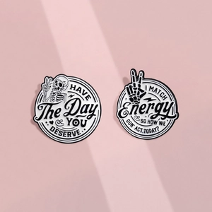 Funny skeleton enamel pins with Have The Day You Deserve text on pink background