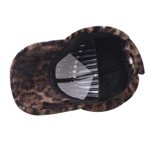 Detailed interior view of leopard print faux fur baseball cap with black fabric lining