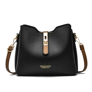 Fashionable black leather handbag with brown straps and golden metal lock for women