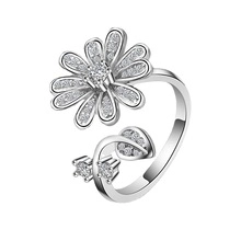 Detail of silver daisy open ring with micro zirconia inlay and adjustable band