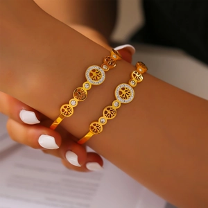 Elegant gold-plated titanium steel cuff featuring an openwork Tree of Life and pavé zircons
