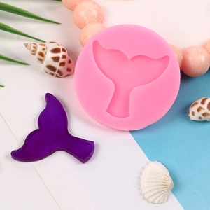 Pink silicone mermaid tail fondant mold with purple finish cake decoration detail