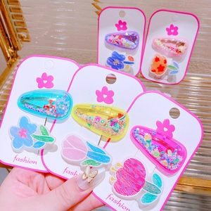 Macro view of colorful glitter hair clips and flower accessories for kids in multiple sets