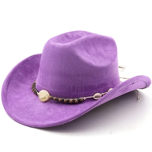 Detail of purple faux suede cowboy hat featuring ethnic beads and shell decorations