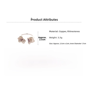 Detailed view of silver open ring with flower design and purple zircon stones