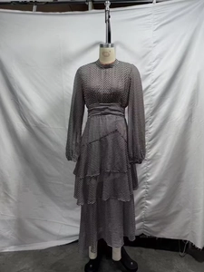 Detail of vintage polka dot chiffon dress with layered ruffles and long lantern sleeves