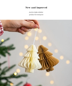 Close-up of handmade honeycomb paper Christmas tree ornaments in cream and brown