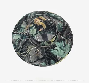 Close-up of leafy camouflage sun hat showing wide brim stitching and metal eyelets