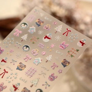 Winter cartoon nail art stickers with snowman, penguin, and bear in soft pastel laser finish
