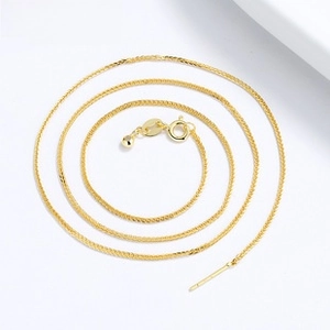 Close-up of gold-plated silver needle-tip chain with spring clasp for DIY jewelry