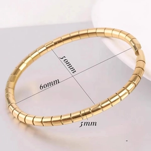 Gold bamboo-style titanium steel oval bracelet showing 60mm and 50mm inner dimensions