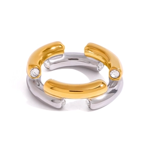 Two-tone gold and silver stainless steel ring with crystal accents on a white background