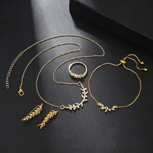 Detailed four-piece wheat leaf jewelry set with zircons on dark textured background
