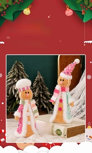 Close-up of knit gingerbread couple figurines with sequins and faux fur Christmas details