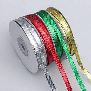 Metallic glitter ribbon rolls in gold silver red and green for DIY gift wrapping decor