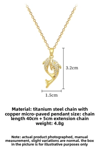 Macro detail of gold-plated titanium steel chain with sparkling pavé dolphin pendant