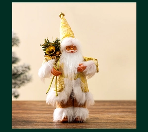 Close-up of a 9-inch gold and white Santa figurine with intricate gold embroidery and bell