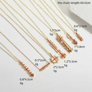 Gold MAMA and LOVE pendant necklaces with cubic zirconia on a minimalist white background