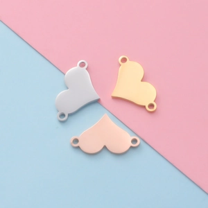 Polished stainless steel heart-shaped pendants in silver, gold, and rose gold finishes
