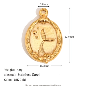 Macro shot of 18K gold plated stainless steel mermaid tail embossed oval pendant with dimensions