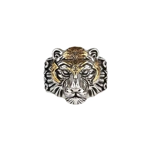 Vintage tiger head ring with gold accents and God's Eye relief on a white background
