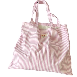 Borsa tote in cotone a righe bianche e rosa con etichetta Bébé per lo shopping