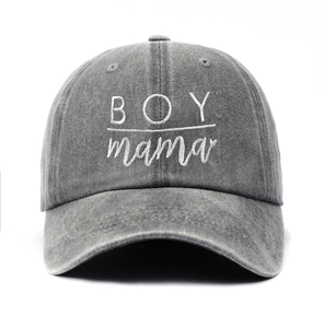 Detailed close-up of white BOY mama embroidery on washed gray cotton baseball cap