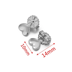 Macro detail of heart-shaped stainless steel earring backs with dimensions 14mm x 10mm