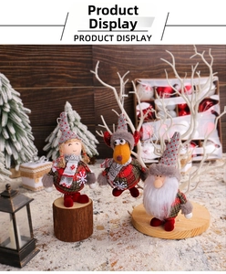 Close-up of festive plaid fabric Christmas dolls featuring Santa, reindeer, and gnomes