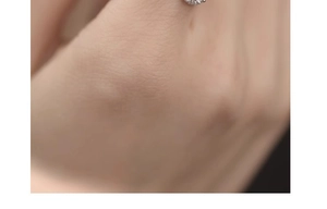 Macro shot of a shimmering square diamond ring on a silver adjustable chain band