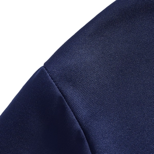 Close-up of navy blue polo shirt fabric showing breathable mesh texture and seam detail