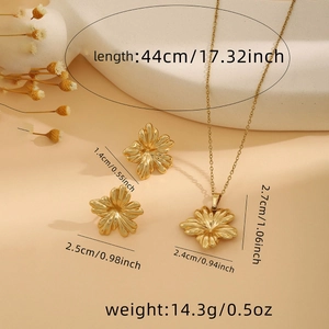 Detailed view of golden flower necklace and earrings set with specific size measurements