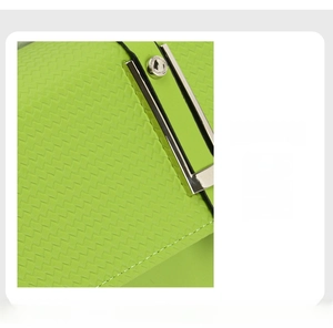 Detail of neon green leather bag showing scratch-resistant woven texture and silver buckle