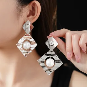 Silver geometric rhombus wave earrings with sparkling crystals and elegant pearls