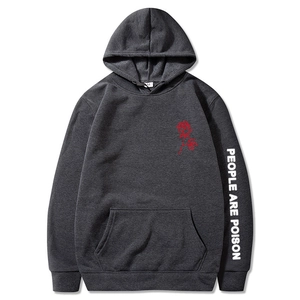 Detail of People Are Poison slogan on charcoal grey hoodie sleeve with red rose print