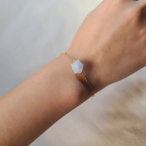 Irregular natural crystal stone bracelet with gold stainless steel chain on wrist