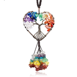 Detail of Tree of Life heart pendant featuring seven chakra tumbled stones and tassels