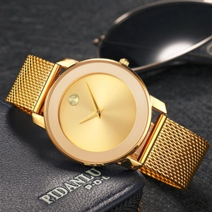 Minimalist gold mesh band watch featuring a sleek dial shown on a dark leather wallet