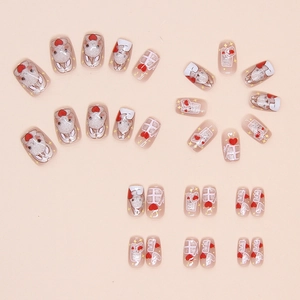 Close-up of cat-eye press-on nails featuring cute rabbits, red hearts and glitter stars