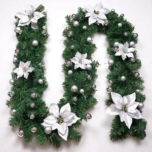 Close-up of 2.7m luxury Christmas garland with white poinsettias and silver ornaments