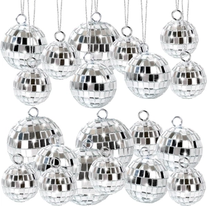 Macro detail of silver disco mirror balls in various sizes with hanging loops and strings