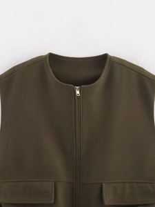Detail of olive green sleeveless vest featuring a round neck and sturdy metal zipper