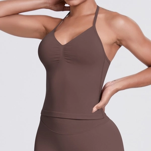 Detail view of coffee brown seamless ribbed sports top with cross-neck V-neck design
